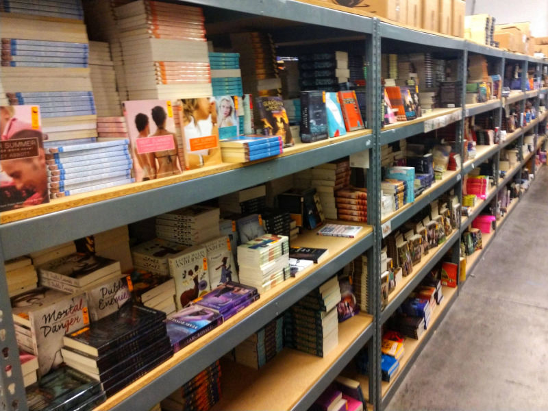 long row of warehouse shelves full of chapter books